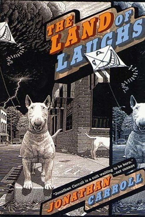 Book cover: the land of laughs by jonathan carroll. Black and white photo of dogs on a street.