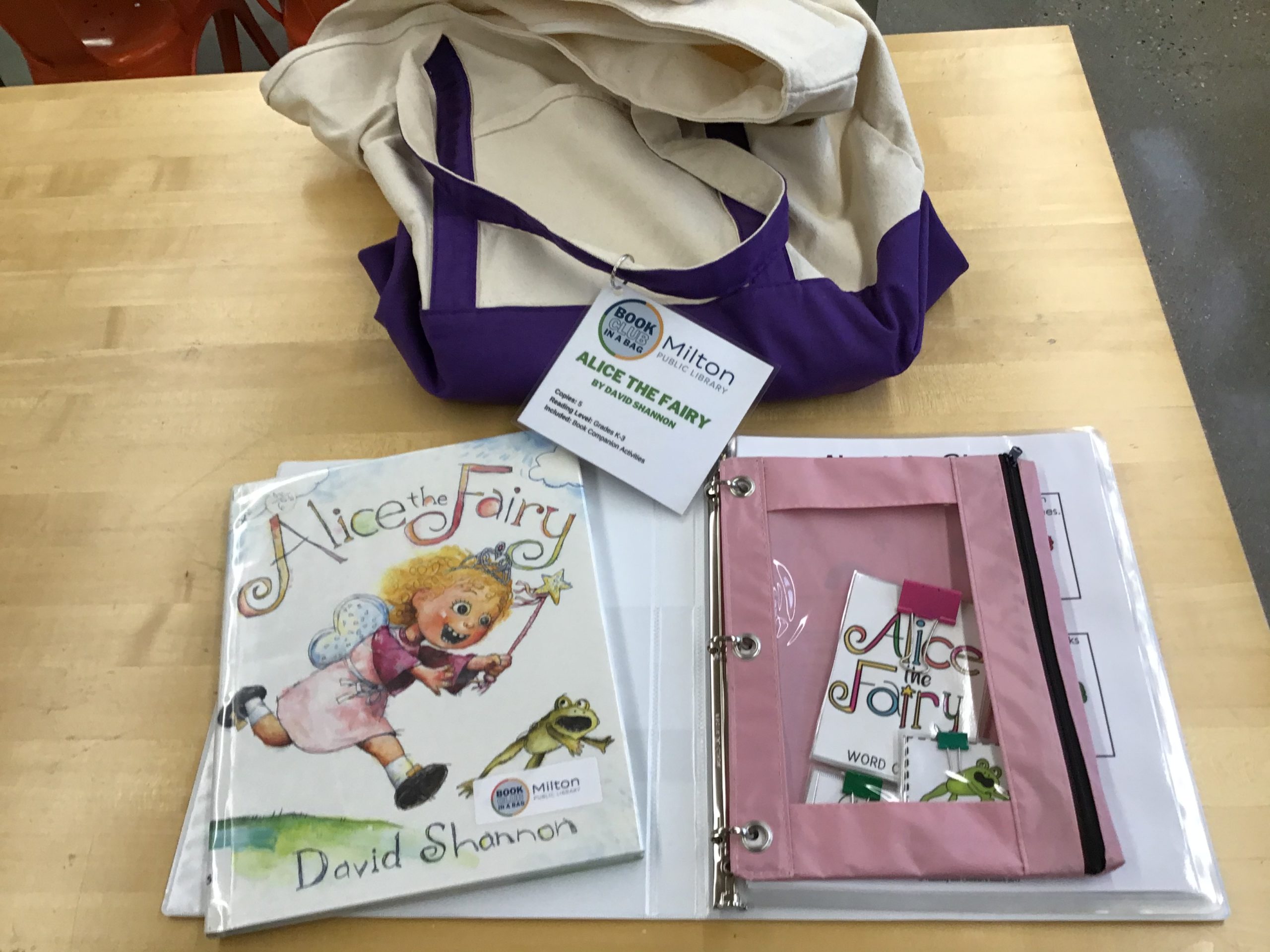 Canvas Bag with the book Alice the Fairy and the book club guide next to it