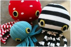 A red, blue, and black and white octopus made out of socks
