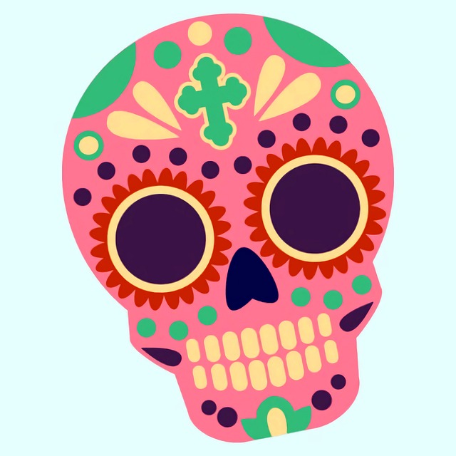 Pink Day of the Dead Calavera with colorful accents on the skull.