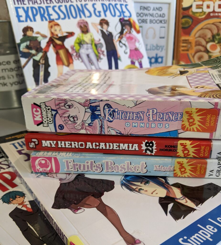A stack of teen anime books.