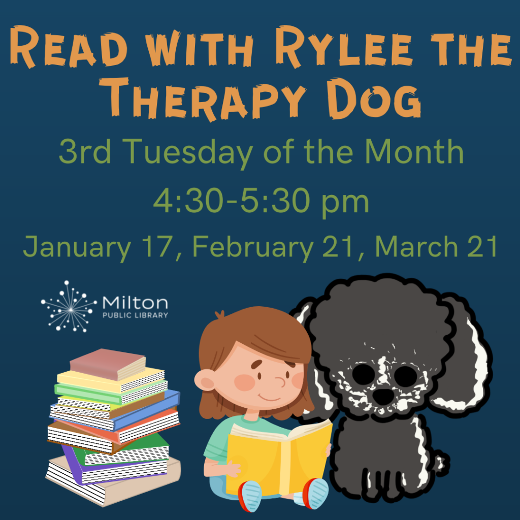 A child reading a book to a gray dog