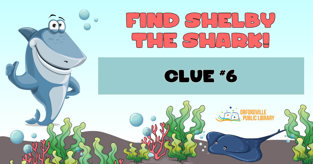 Illustrated underwater scene featuring a shark, colorful seaweed, and a stingray. Words read: Find Shelby the Shark. Clue #6.