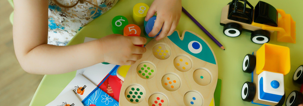 Preschool kid working at table