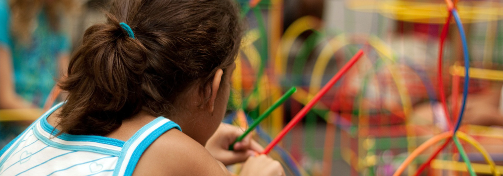 Girl playing with building toys