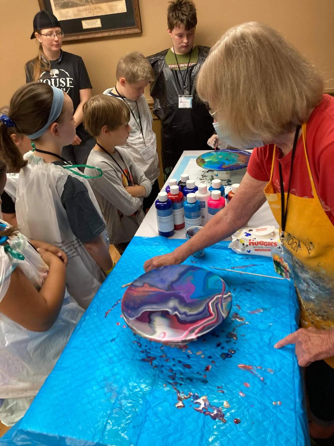 Nancy McKinnon demonstrated how to pour acrylic paint.