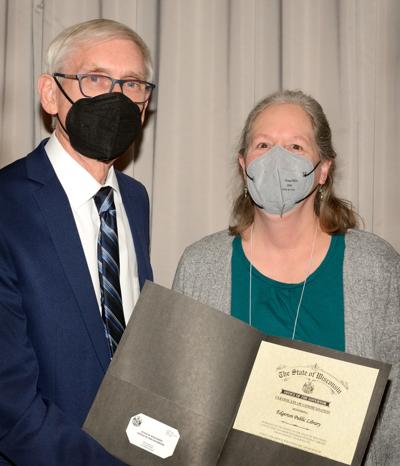 2022 WLA Library Legislative Day. Governor Tony Evers presents certificate to Kirsten Almo, Director of Edgerton Public Library.